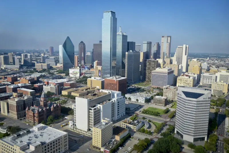 Luxury Dallas Arts District limestone architecture and evening reflection pool