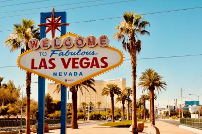 Luxury Las Vegas resort fountains and glowing golden architecture at night
